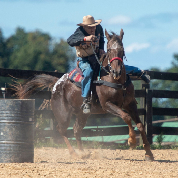 Adam & Abbie Barrel Racing in a rodeo